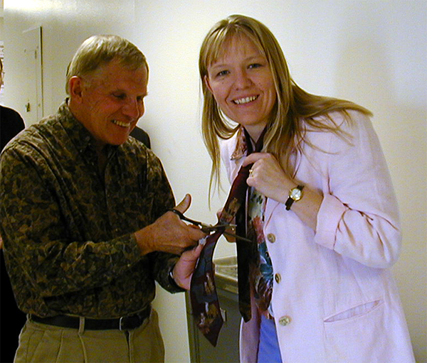 Prof. Cotton cuts Sue van den Heever's tie