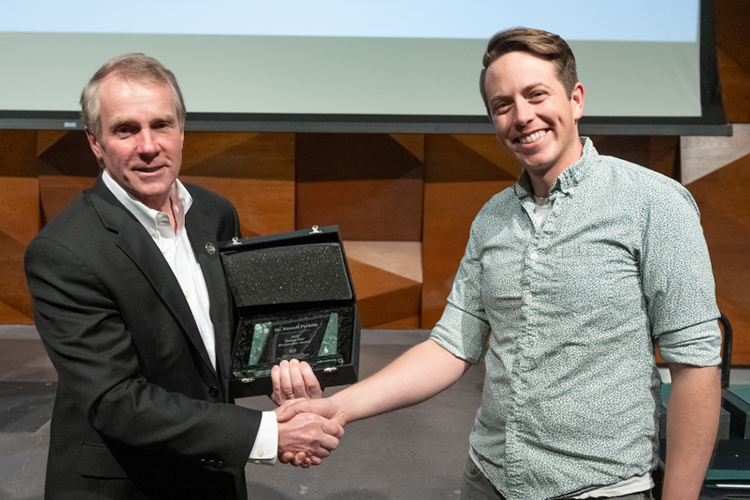 Russell Perkins accepts Outstanding Researcher Award–Rising Star