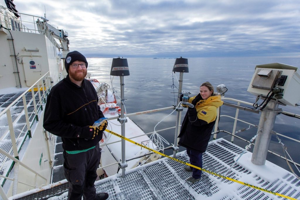 Two people on ship working